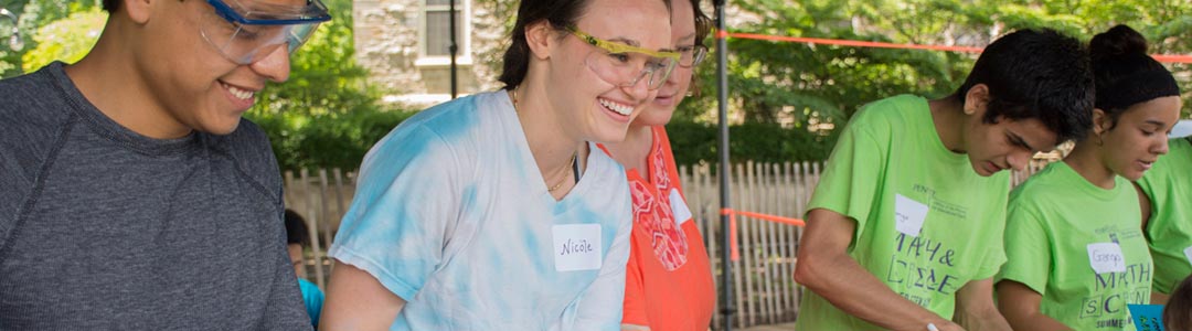 engineering ambassadors demonstrate how science and engineering can be fun at a STEM education event