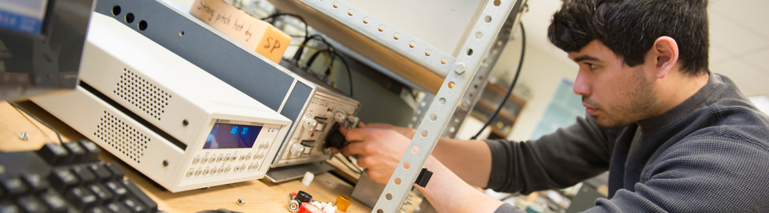 male engineering graduate student at work in the lab