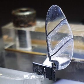 A small mechanical wing is attached to an apparatus