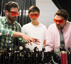 foley and grad students in lab