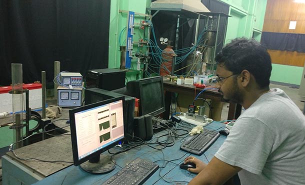 Chandrachur Bhattacharya works on a computer, monitoring machinery.