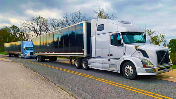 platoon of tractor trailer trucks