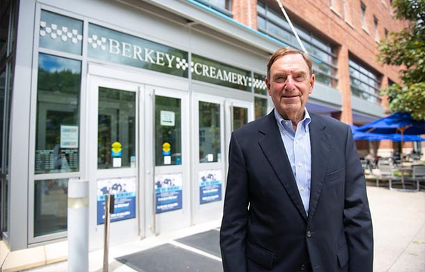 chuck schnedier stands outside Berkey Creamery on penn state campus