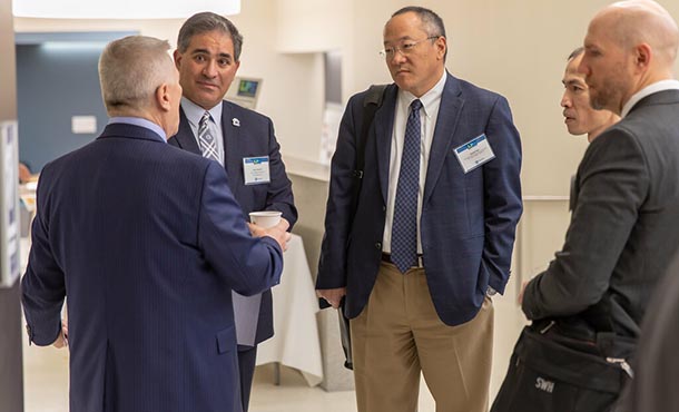 Justin Schwartz with President Eric Barron and David Han