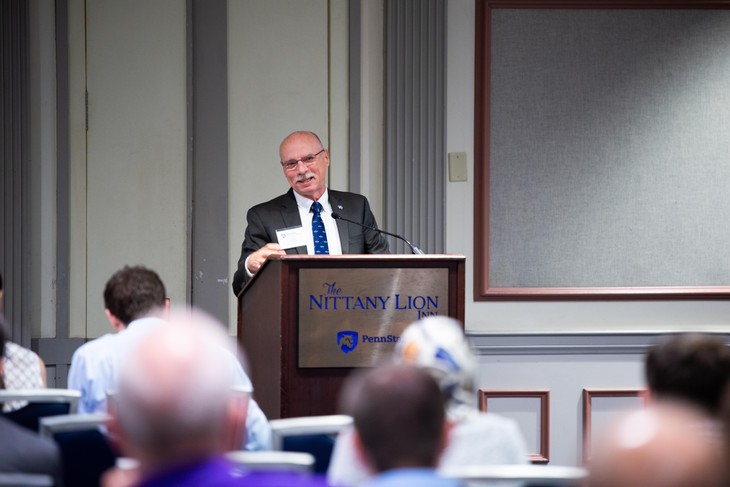 Neil Sharkey speaking at podium