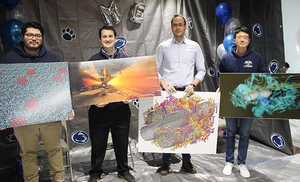 students hold their award-winning visuals