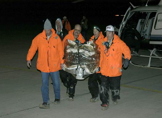 The Stardust sample return capsule was transported by helicopter from its landing site at the U.S. Air Force Utah Test and Training Range,January 15, 2006. This image shows the return capsule inside a protective covering. The capsule contains cometary and interstellar samples gathered by the Stardust spacecraft.